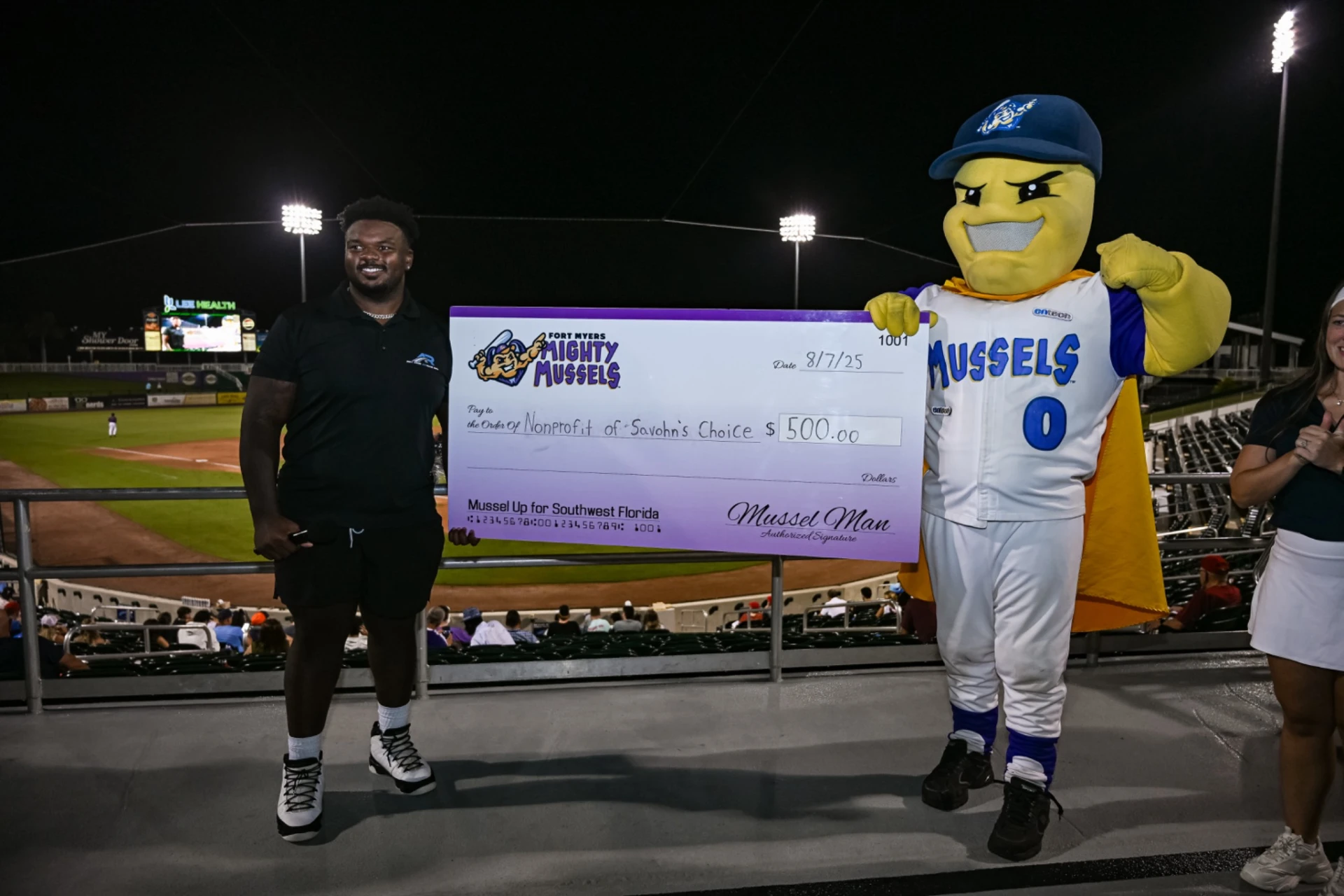 Ave Rides receiving Fort Myers Mighty Mussels community recognition at the ballpark